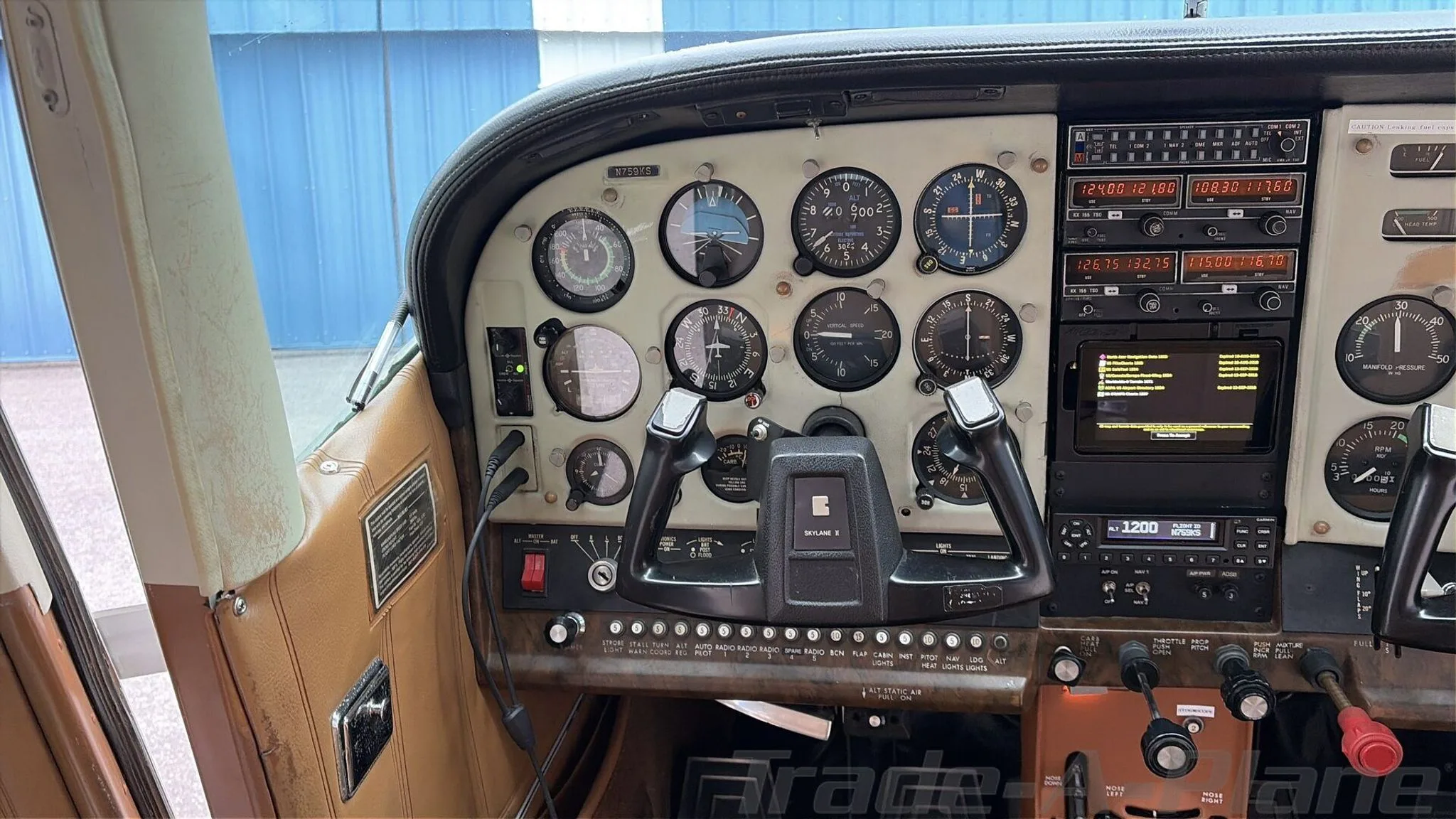 Cockpit and instrument panel of a 1977 CESSNA 182Q SKYLANE.