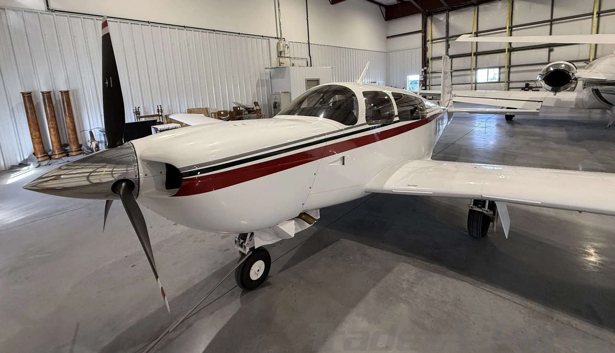 Exterior view of a 2005 MOONEY M20M GX BRAVO, N66YC.