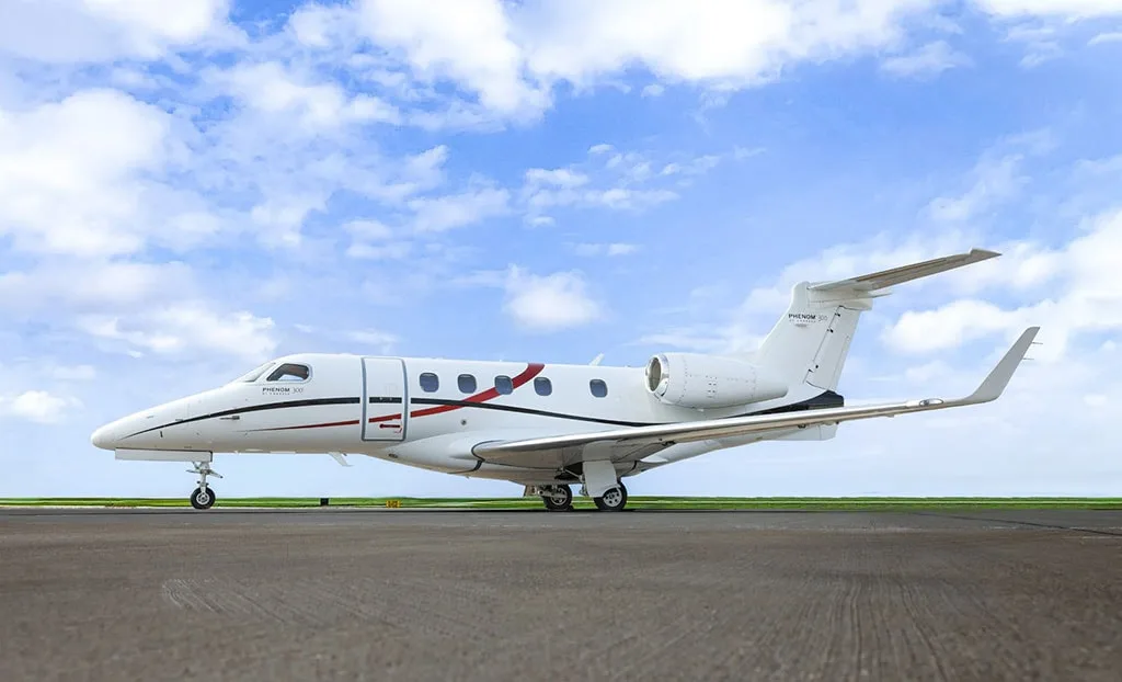 Exterior view of a 2015 Embraer Phenom 300.