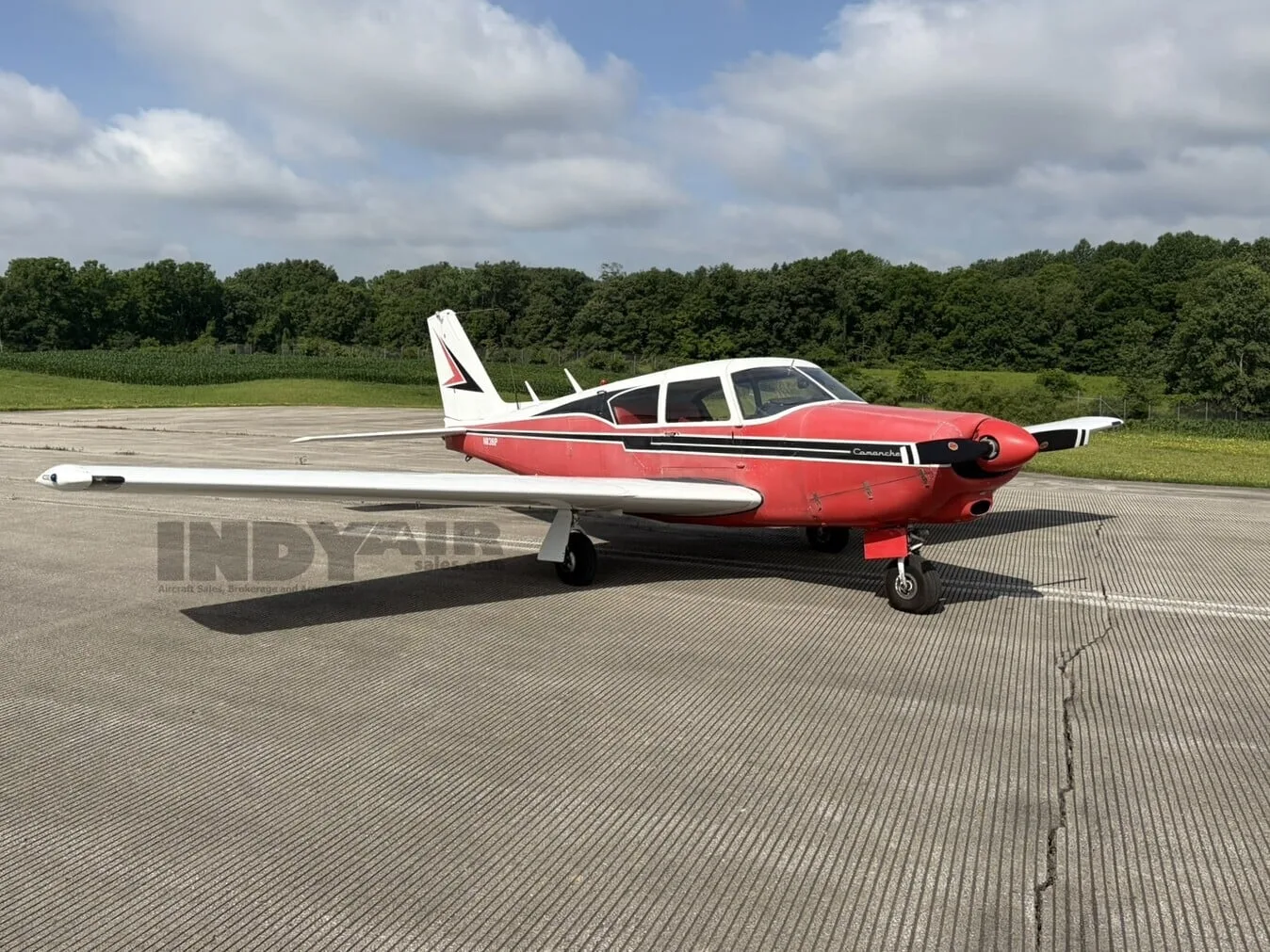 Exterior view of a Piper Comanche 250, N8381P.