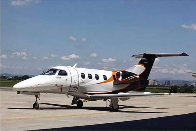 Exterior view of a 2009 Embraer Phenom 100, N770BR.
