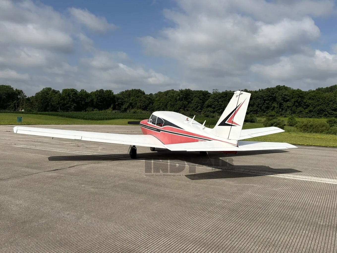 Exterior view of a Piper Comanche 250, N8381P.
