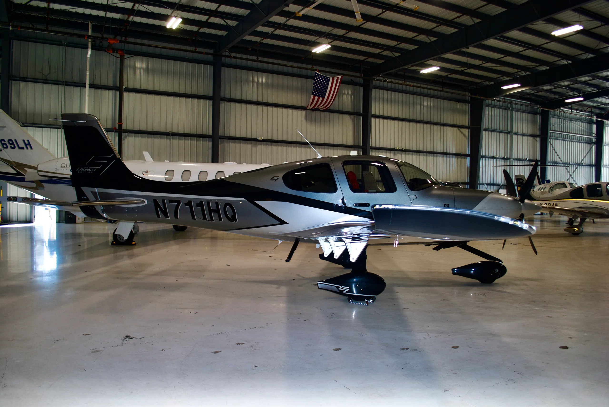 Exterior view of a 2024 Cirrus SR22-G7 Turbo, N711HQ.