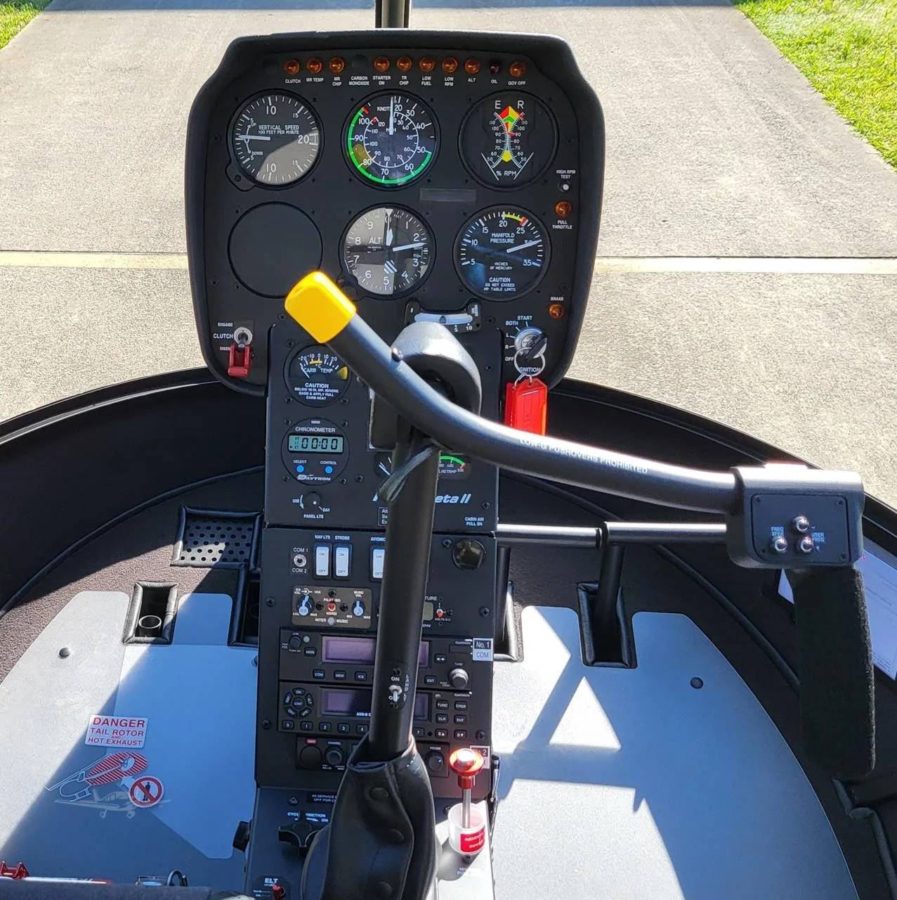 Cockpit and instrument panel of a 2027 ROBINSON R22 BETA II.