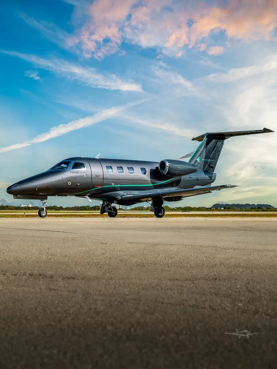 Exterior view of a 2010 EMBRAER PHENOM 100EV, N1WB.