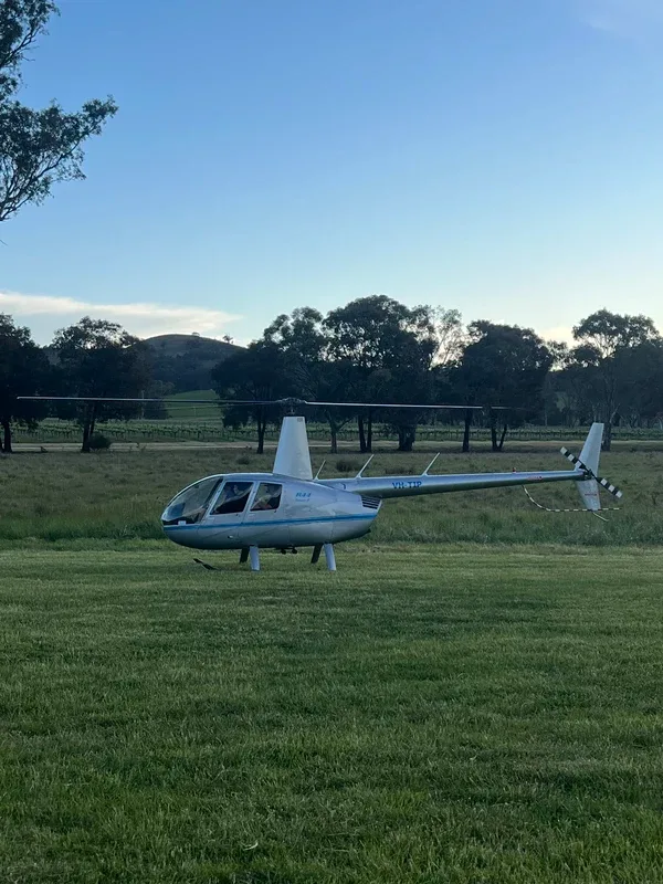 Exterior view of a 2007 Robinson R44 Raven II, VH-TIP.