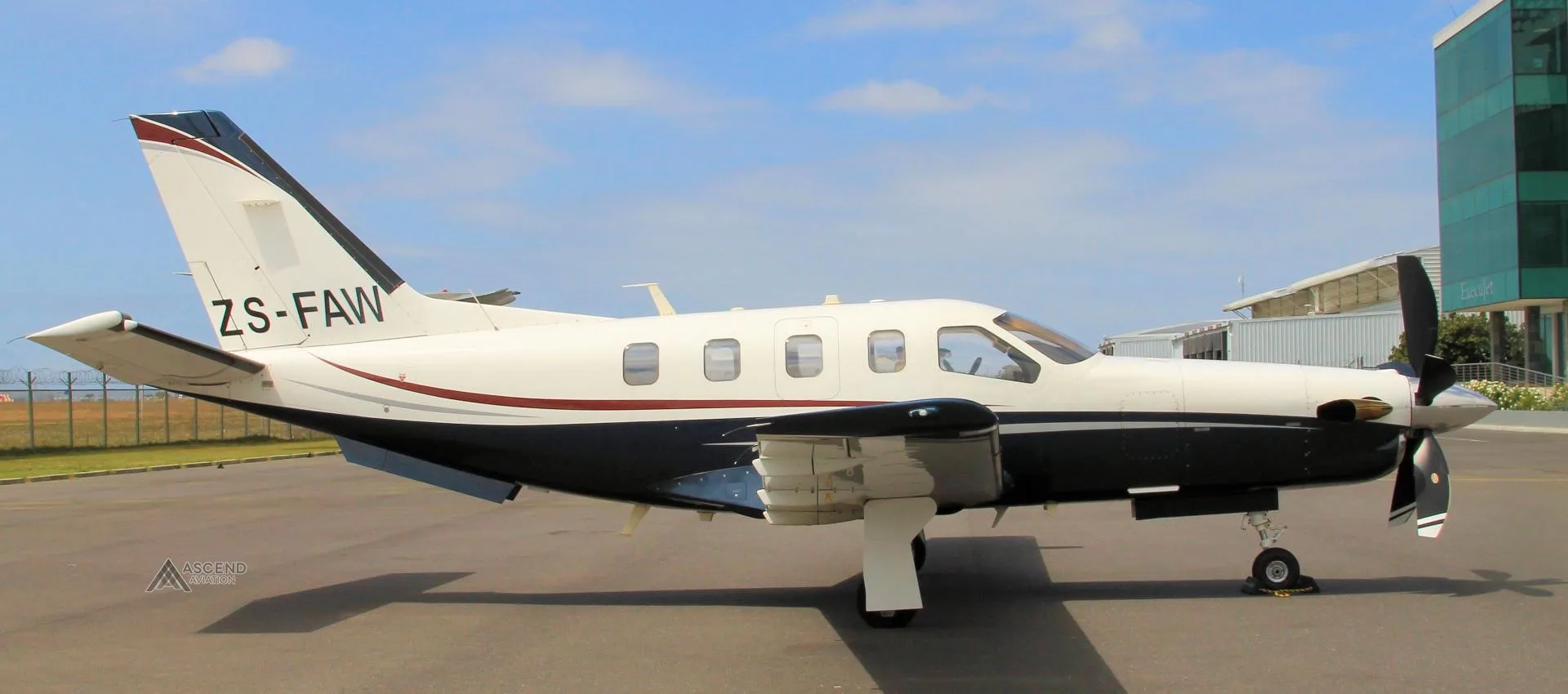 Exterior view of a 2006 DAHER TBM 700C2, ZS-FAW.
