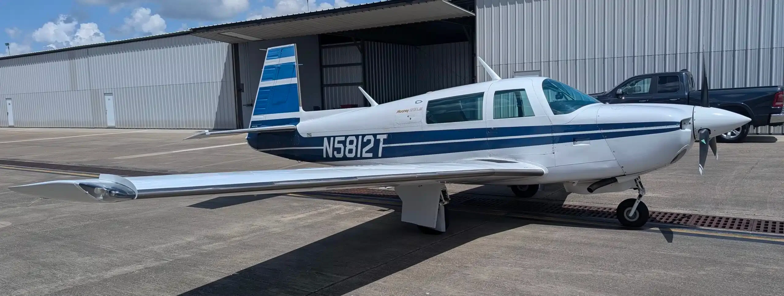Exterior view of a 1977 Mooney M20J, N201SL.