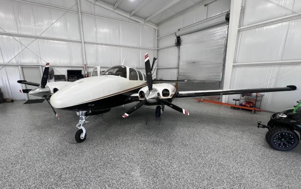 Exterior view of a 1977 BEECHCRAFT 58P BARON, N966UB.