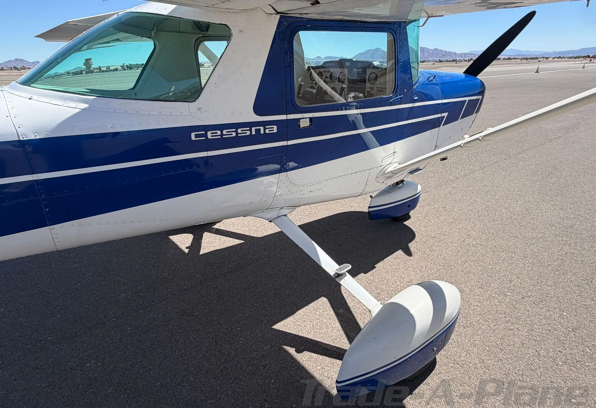 Exterior view of a 1978 CESSNA 152, N49990.