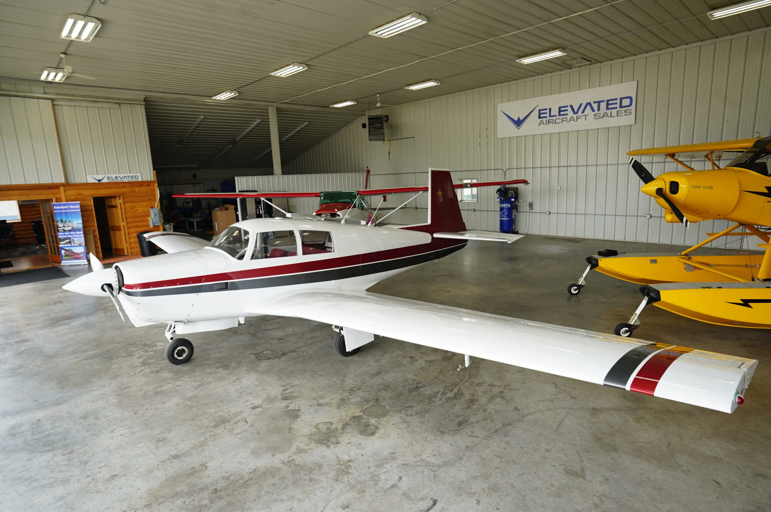 Exterior view of a Mooney M20C, N9211M.