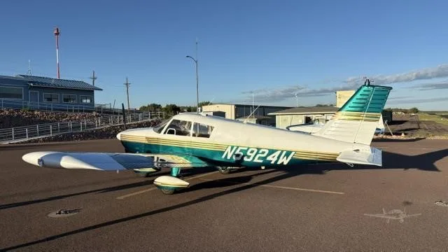 Exterior view of a 1966 PIPER CHEROKEE 180, N5924W.