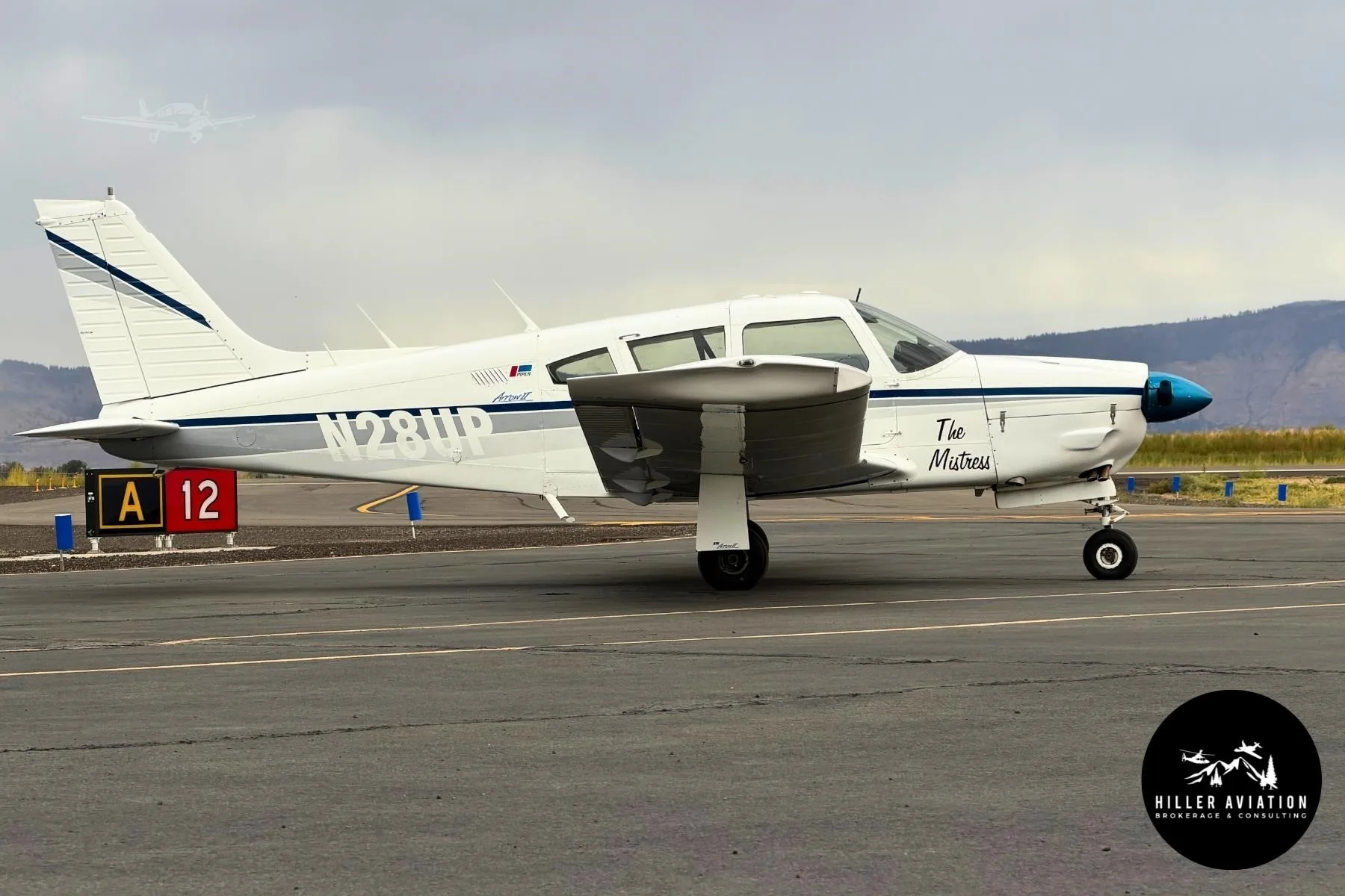 Exterior view of a 1973 PIPER ARROW II, N28UP.