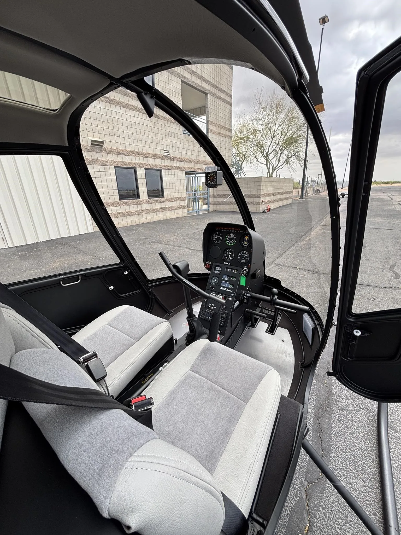 Cockpit and instrument panel of a 2026 ROBINSON R22 BETA II.