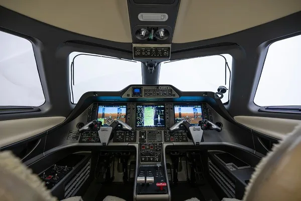 Cockpit and instrument panel of a 2013 Embraer Phenom 100.