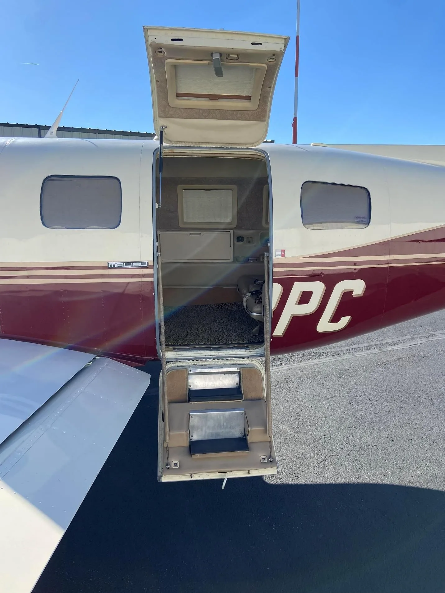 Exterior view of a 1984 Piper M 350, N13PC.