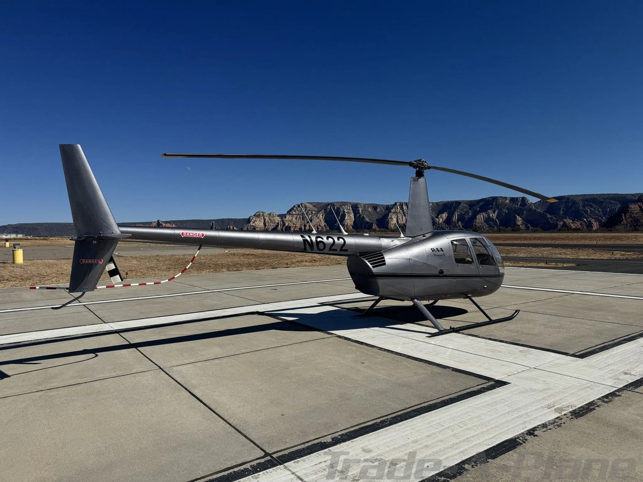 Marketing image of a 2002 ROBINSON R44 RAVEN II.