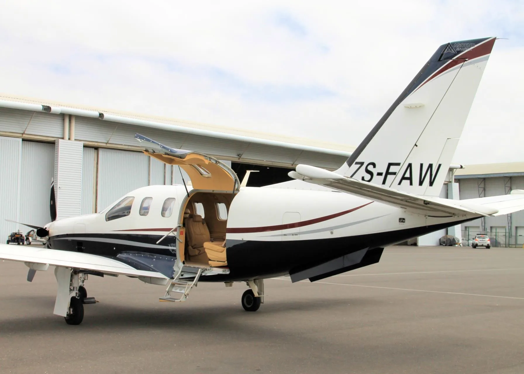Exterior view of a 2006 DAHER TBM 700C2, ZS-FAW.