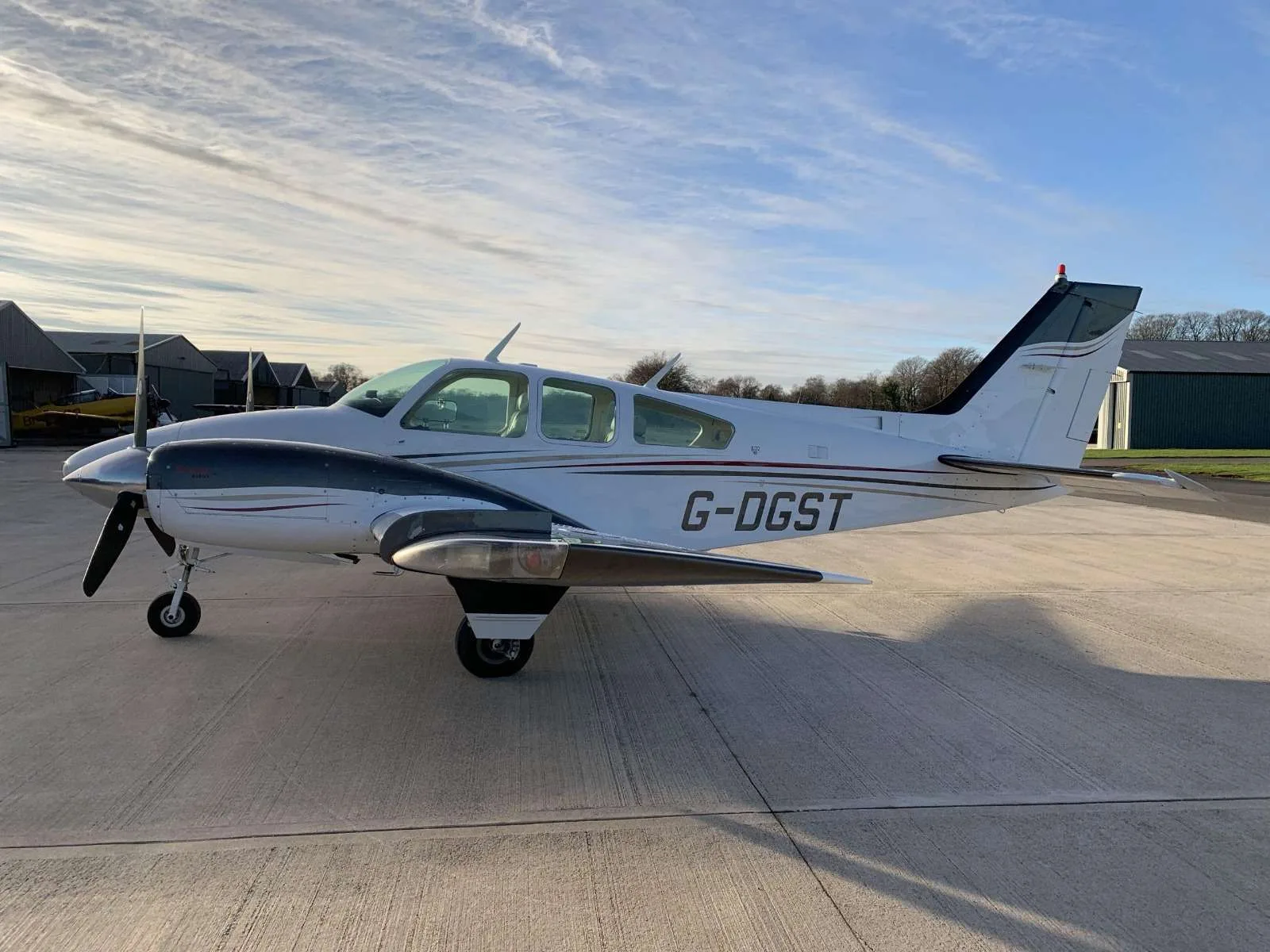 Exterior view of a 1976 Beechcraft Baron B55, G-DGST.