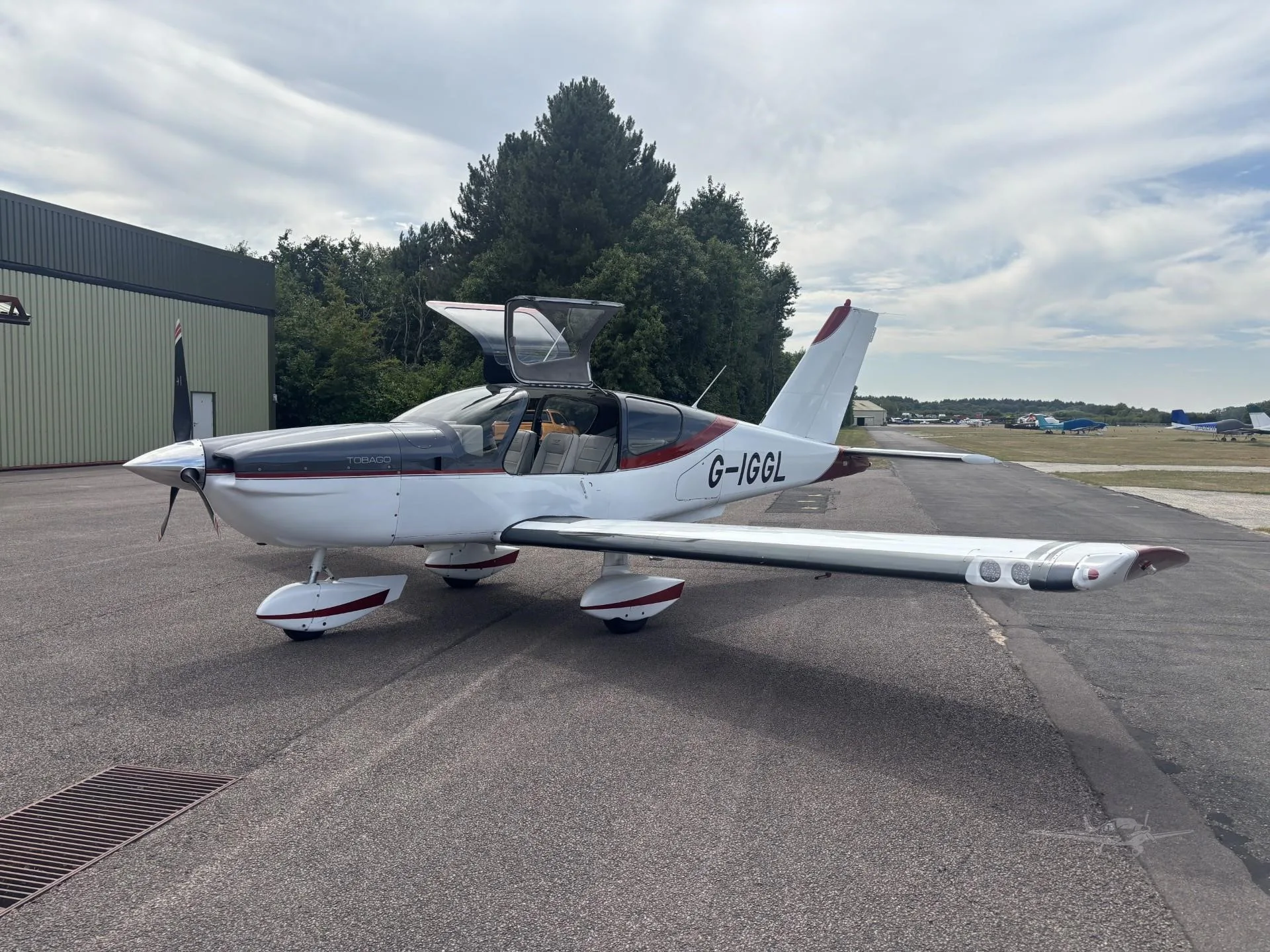 Exterior view of a 1980 SOCATA TB-10 TOBAGO, G-IGGL.