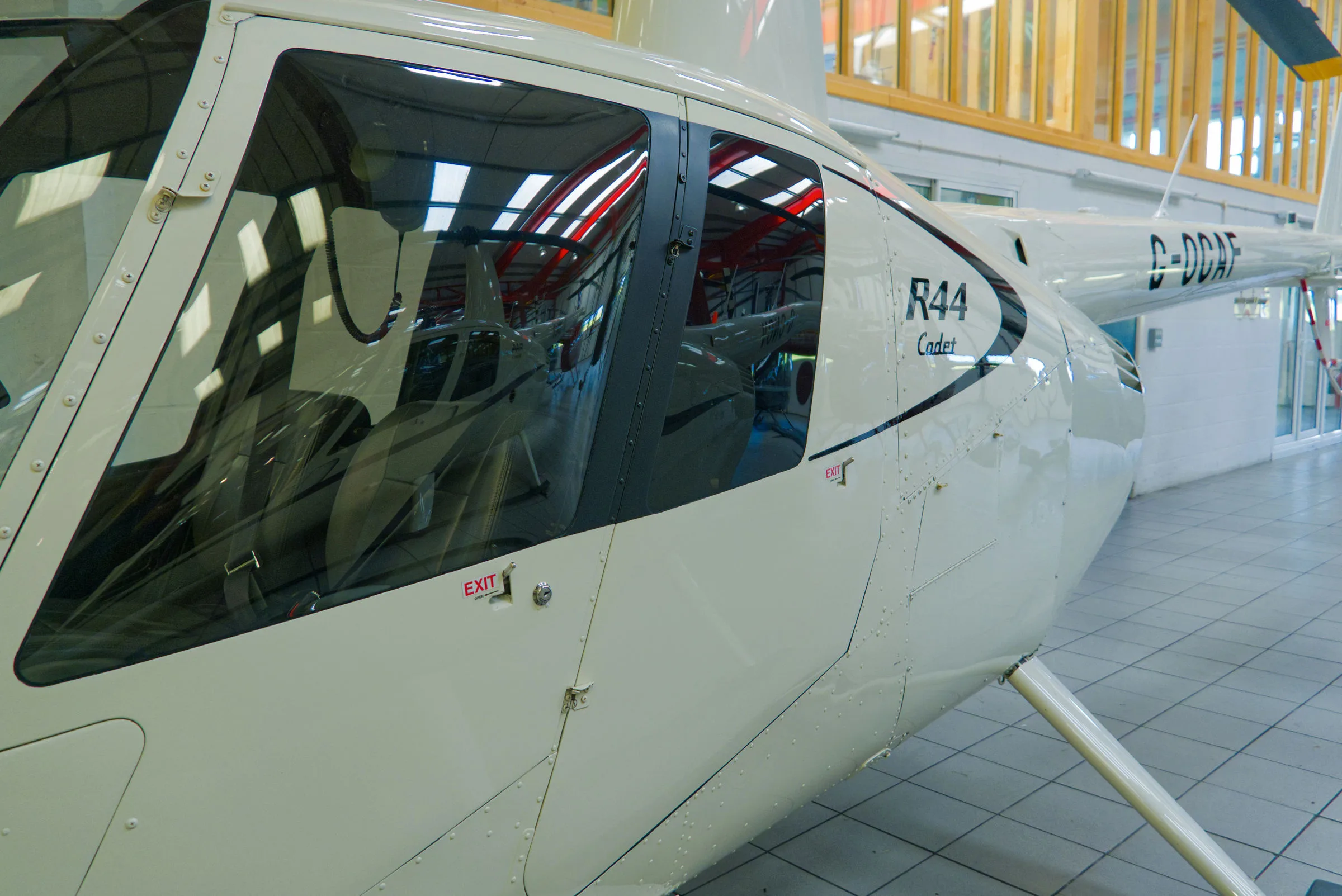 Exterior view of a 2018 Robinson R44 Cadet, G-OCAF.
