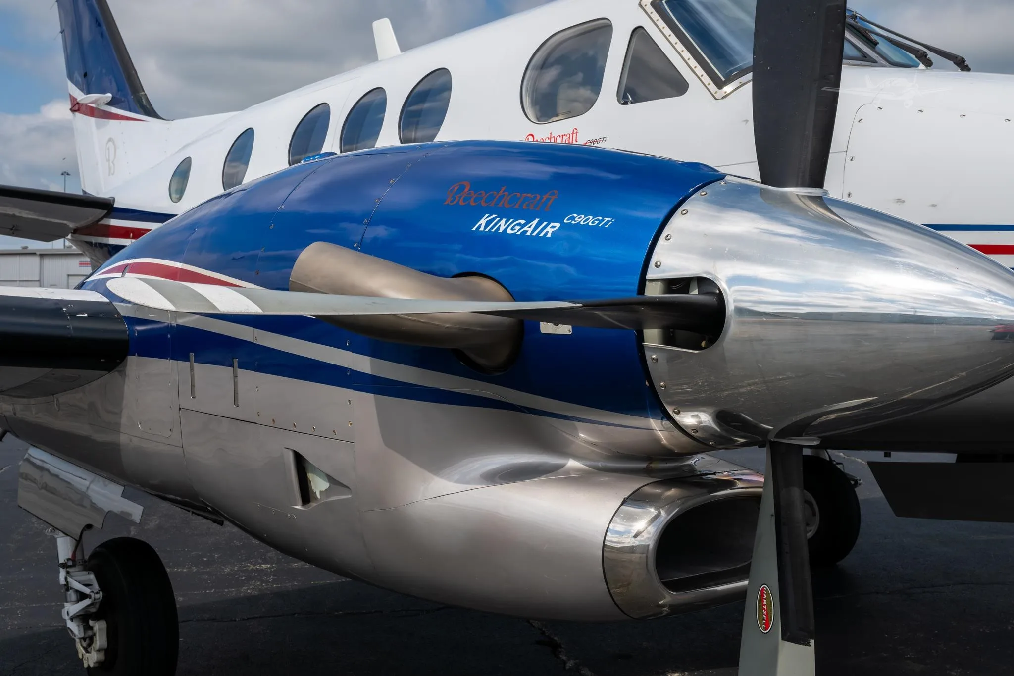 Exterior view of a 2009 BEECHCRAFT KING AIR C90GTI, N6211J.