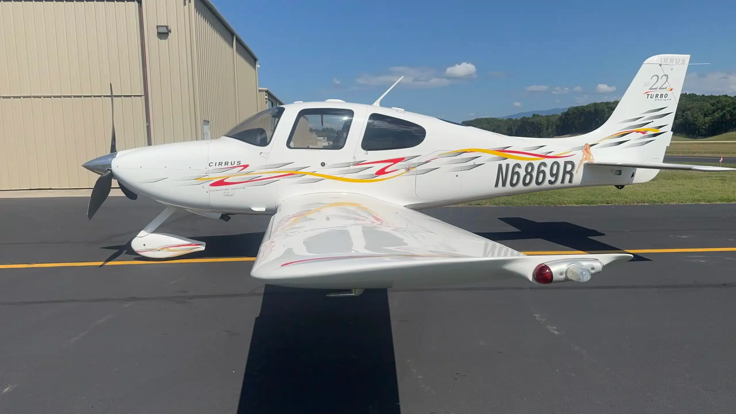 Exterior view of a 2014 Cirrus SR22T G5 GTS, N308AW.