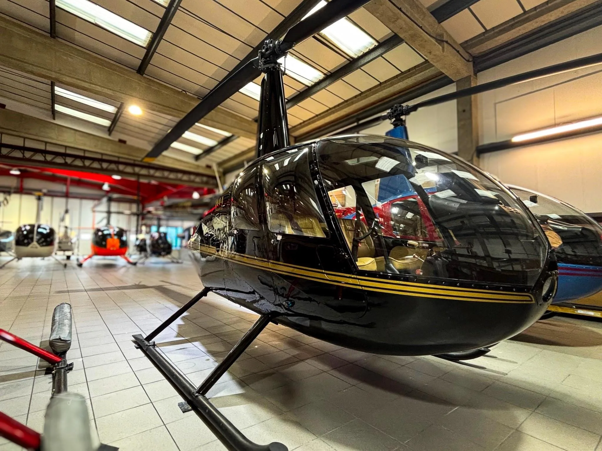 Exterior view of a 2006 ROBINSON R44 RAVEN II.
