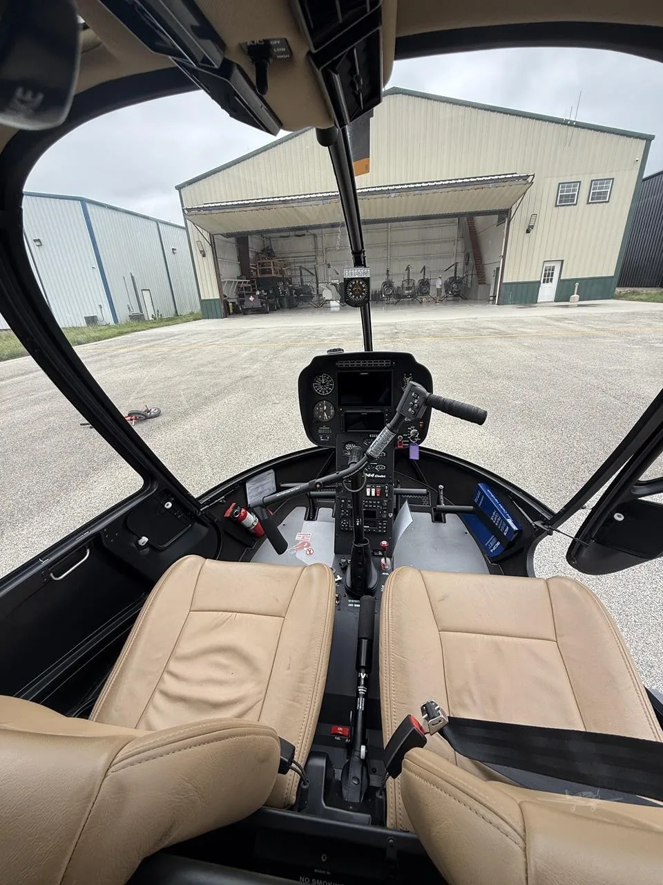 Cockpit and instrument panel of a 2025 ROBINSON R44 CADET.