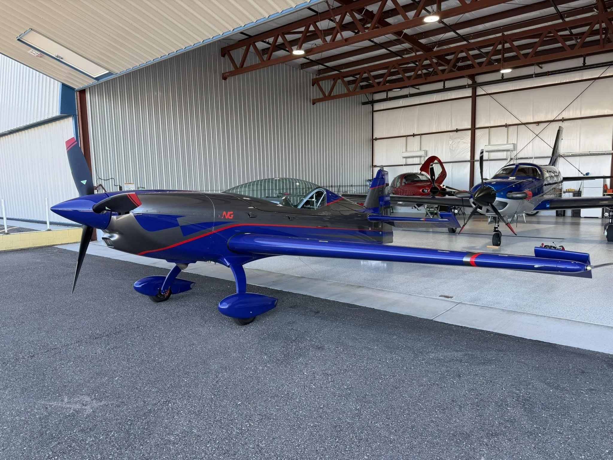 Exterior view of a 2024 EXTRA AIRCRAFT EA NG, N76NG.