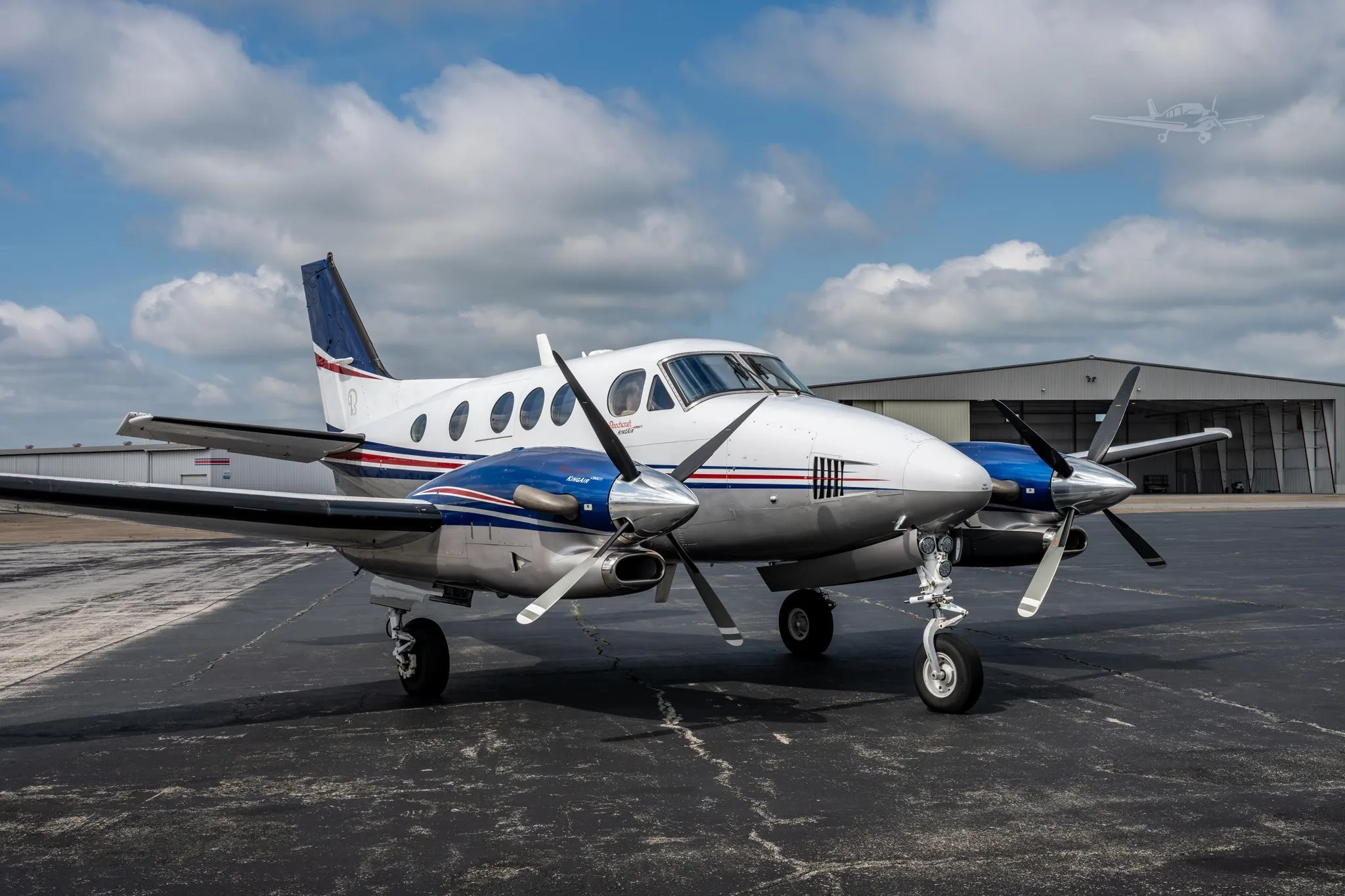 Exterior view of a 2009 BEECHCRAFT KING AIR C90GTI, N6211J.