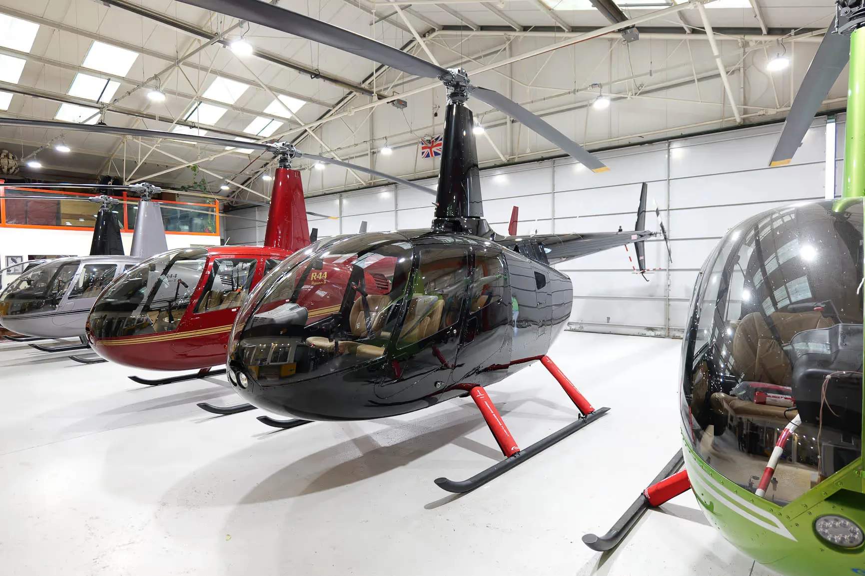 Exterior view of a 2011 Robinson R66, G-DIGA.