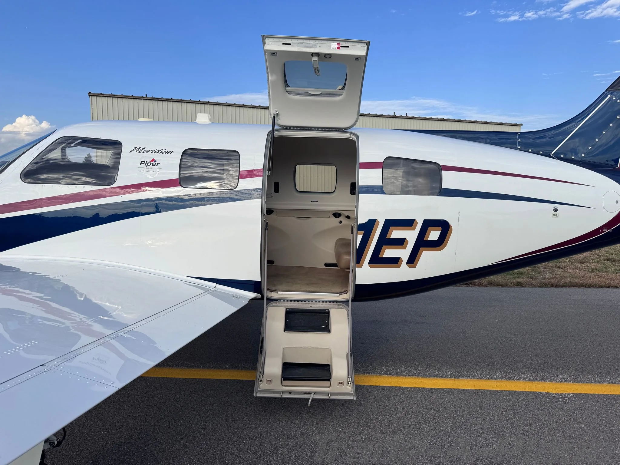 Exterior view of a 2013 PIPER MALIBU MERIDIAN, N21EP.