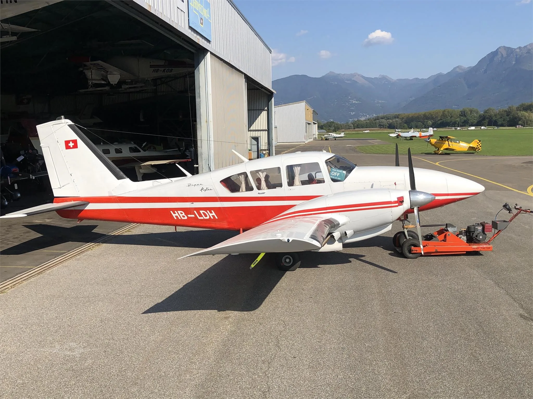 Exterior view of a 1966 PIPER TURBO AZTEC, HB-LDH.
