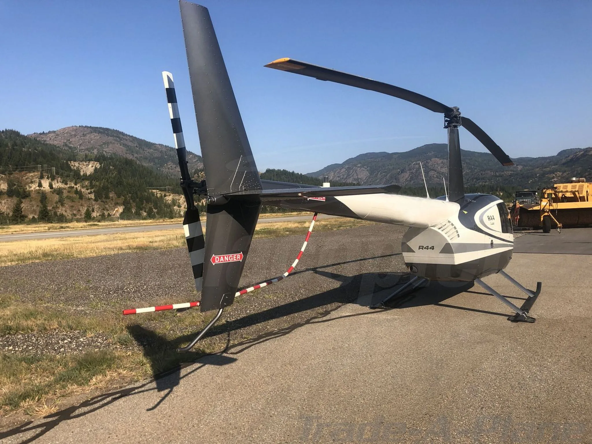 Exterior view of a 2017 ROBINSON R44, C-GFEE.