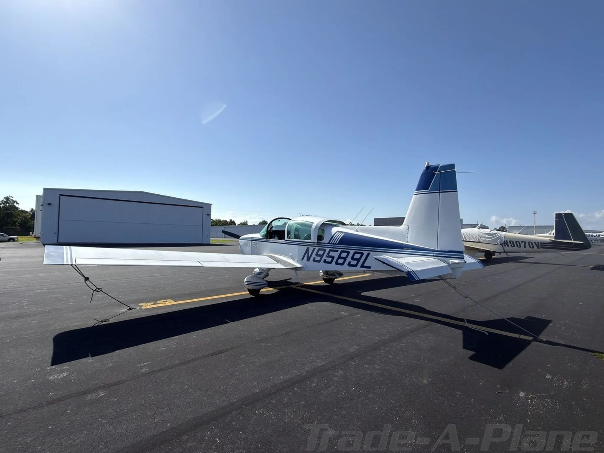 Exterior view of a 1974 GRUMMAN/AMERICAN GENERAL AA5 TRAVELER, N9589L.