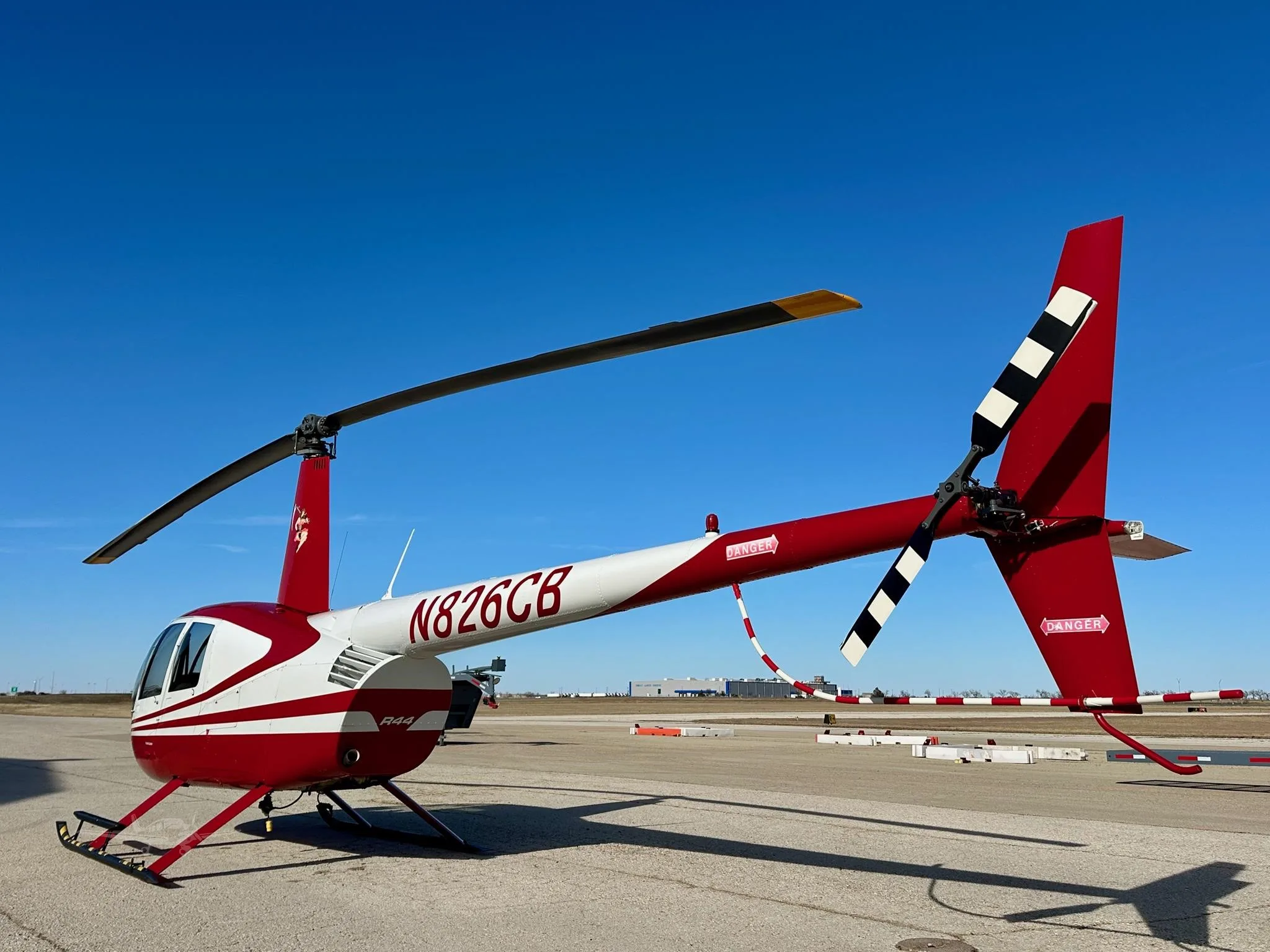 Exterior view of a 2006 ROBINSON R44 RAVEN II, N826CB.
