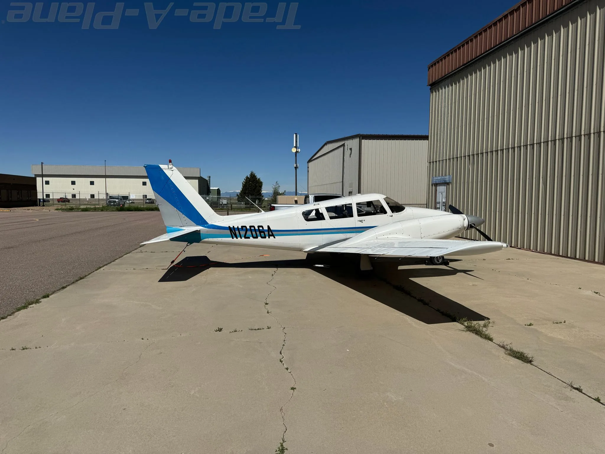 Exterior view of a 1966 PIPER TWIN COMANCHE, N1206A.