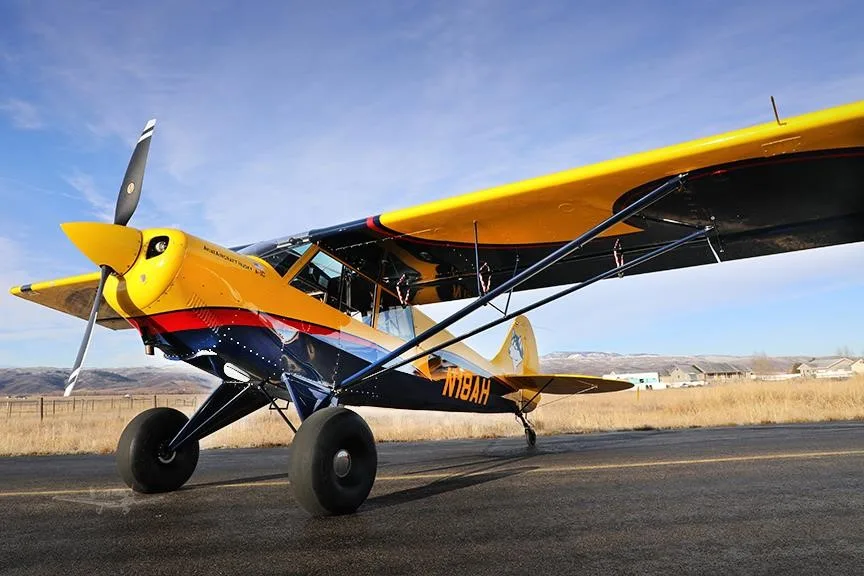 Exterior view of a 2019 AVIAT HUSKY A-1C-180, N18AH.