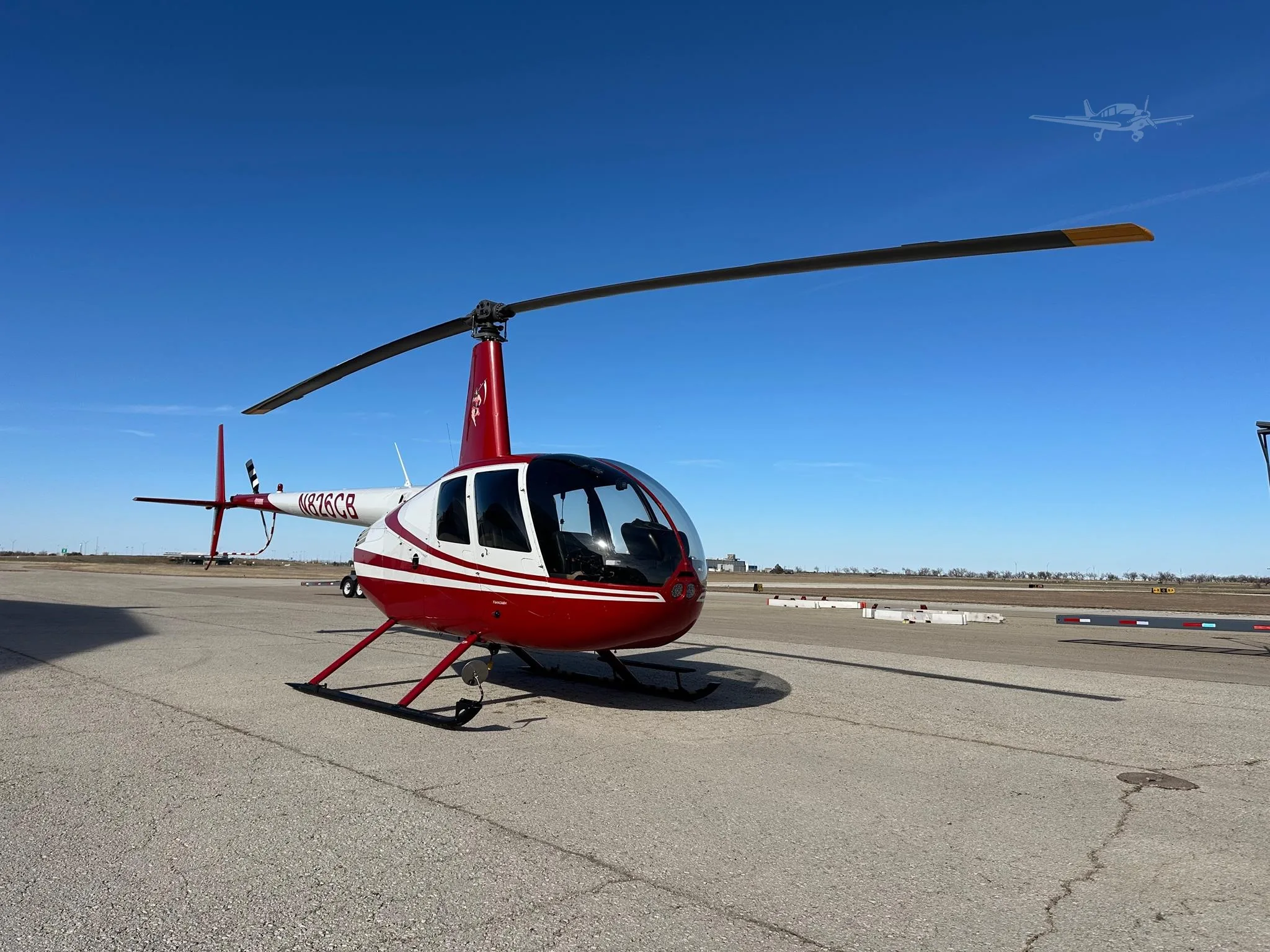 Exterior view of a 2006 ROBINSON R44 RAVEN II, N826CB.