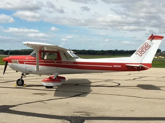 Exterior view of a Cessna 152, N65561.