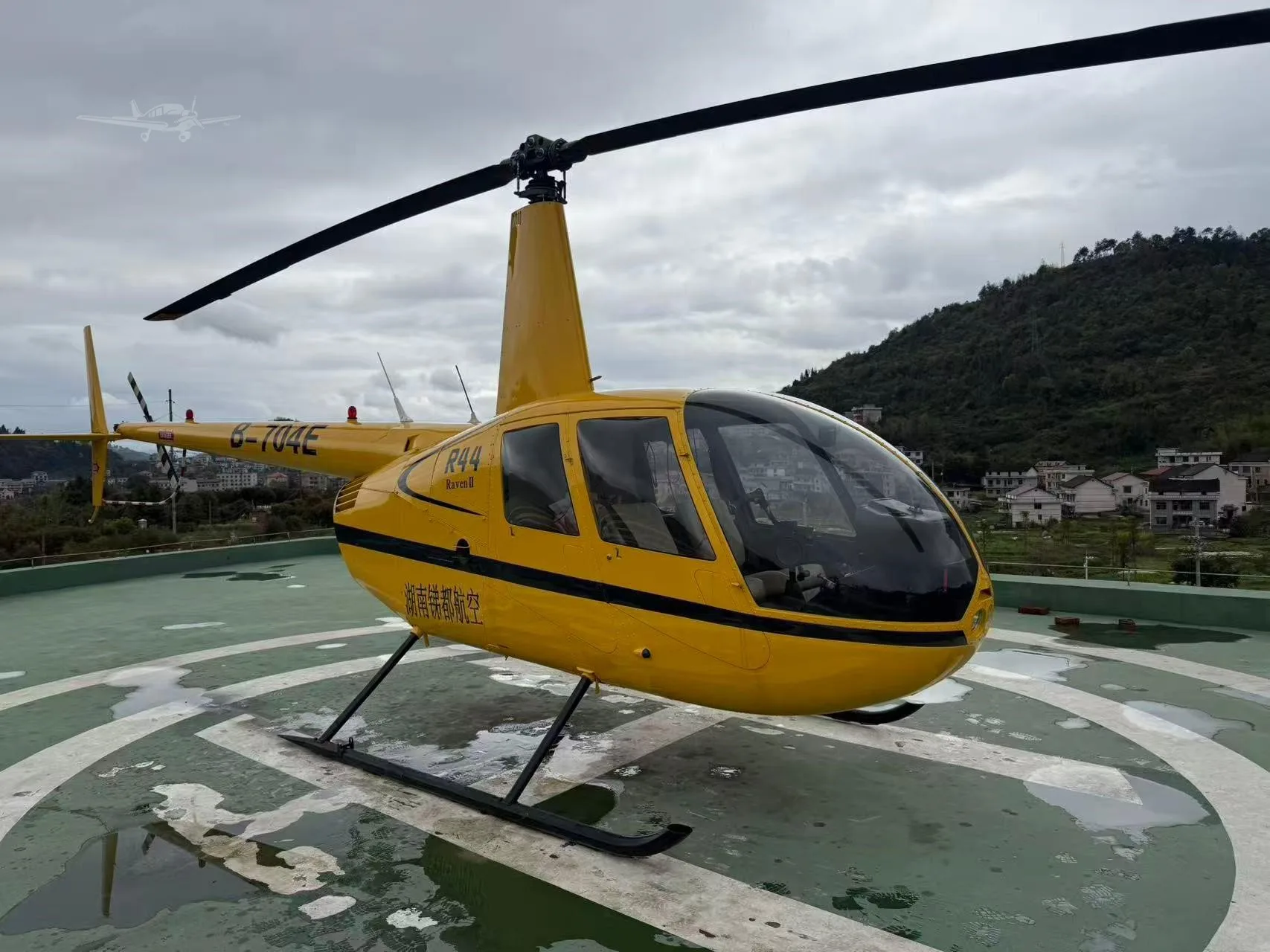 Exterior view of a 2003 ROBINSON R44 RAVEN II.