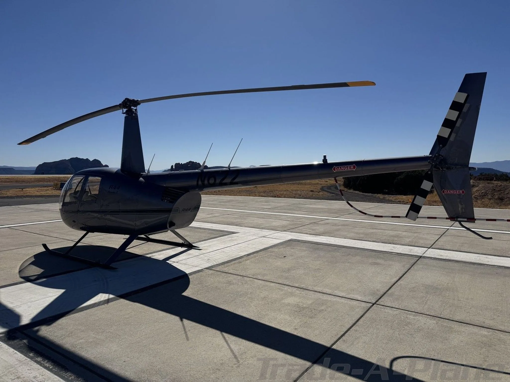 Exterior view of a 2002 ROBINSON R44 RAVEN II, N622.