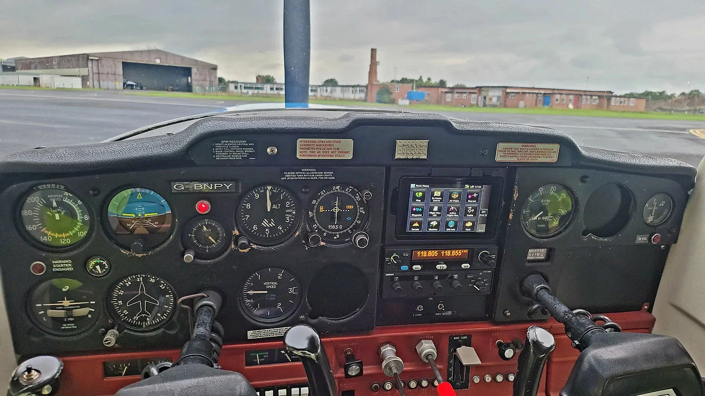 Cockpit and instrument panel of a 1977 Cessna 152.