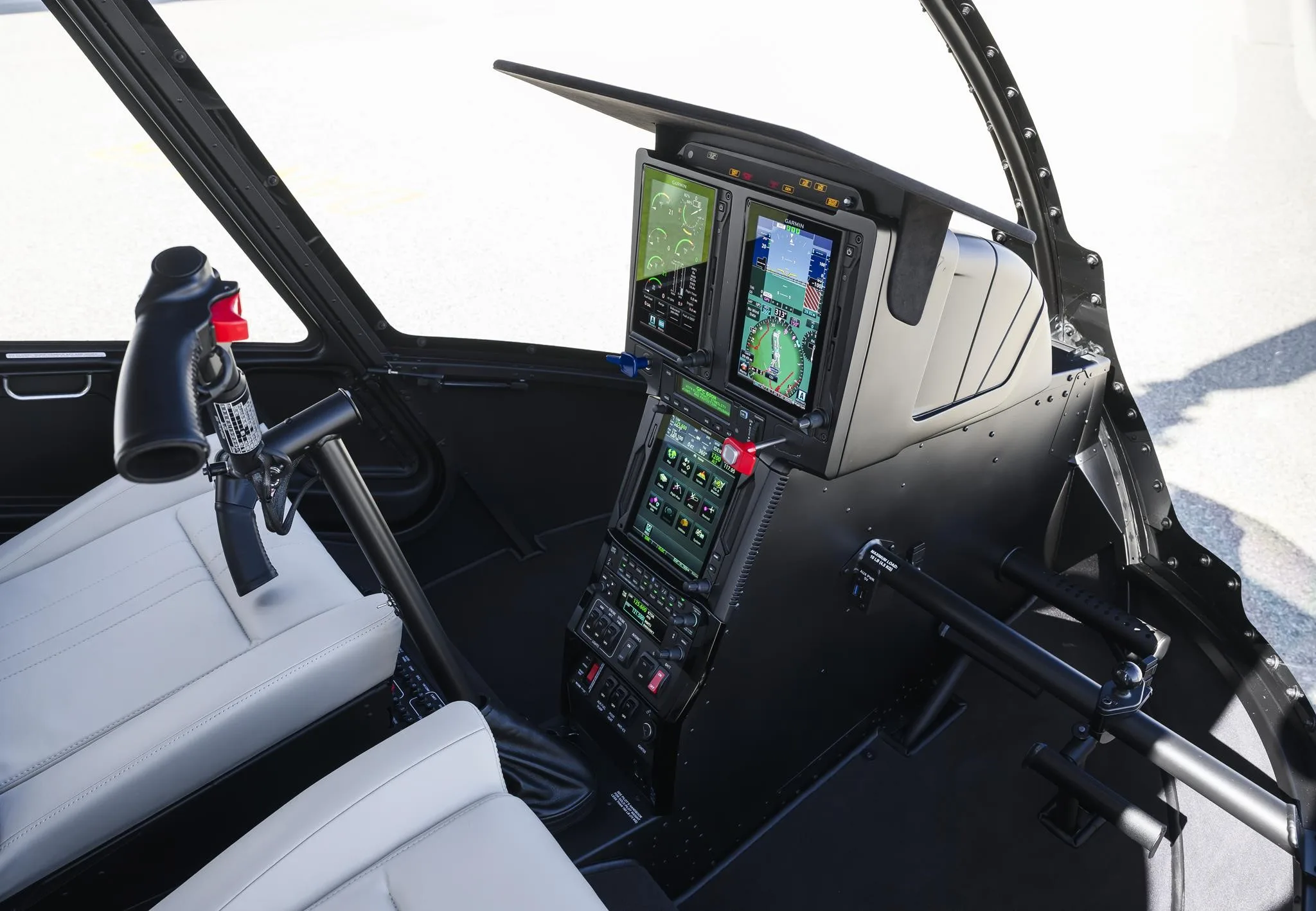 Cockpit and instrument panel of a 2027 ROBINSON R66 NXG.