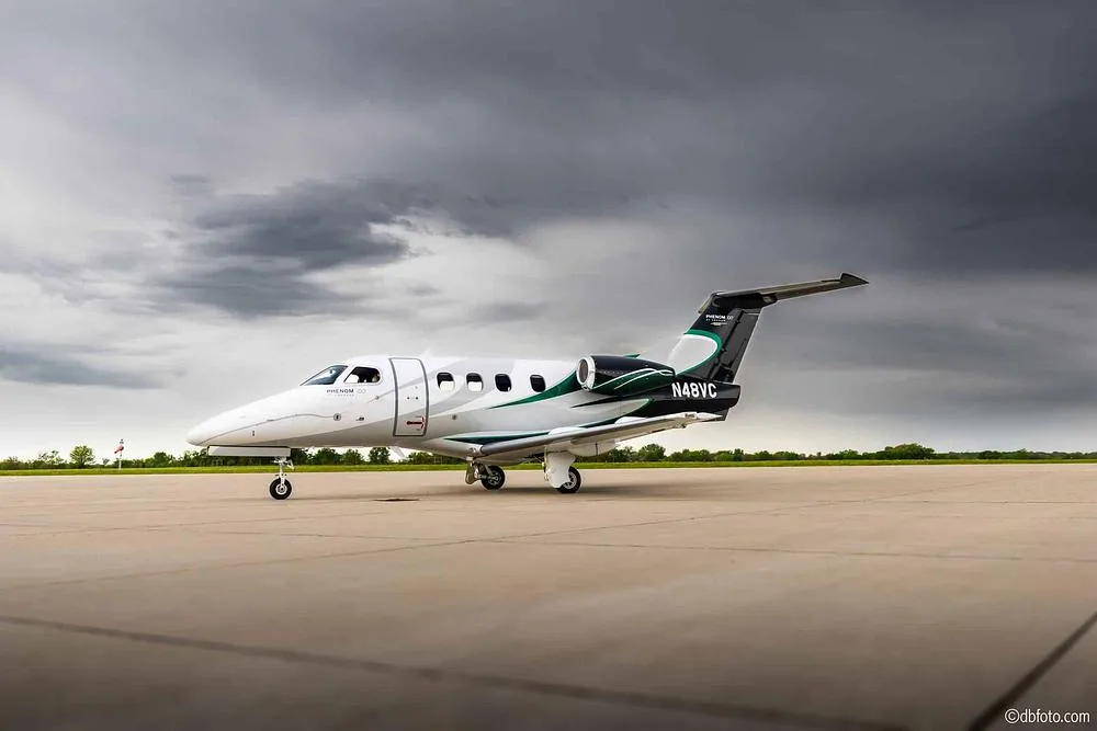 Exterior view of a 2012 Embraer Phenom 100, N48VC.
