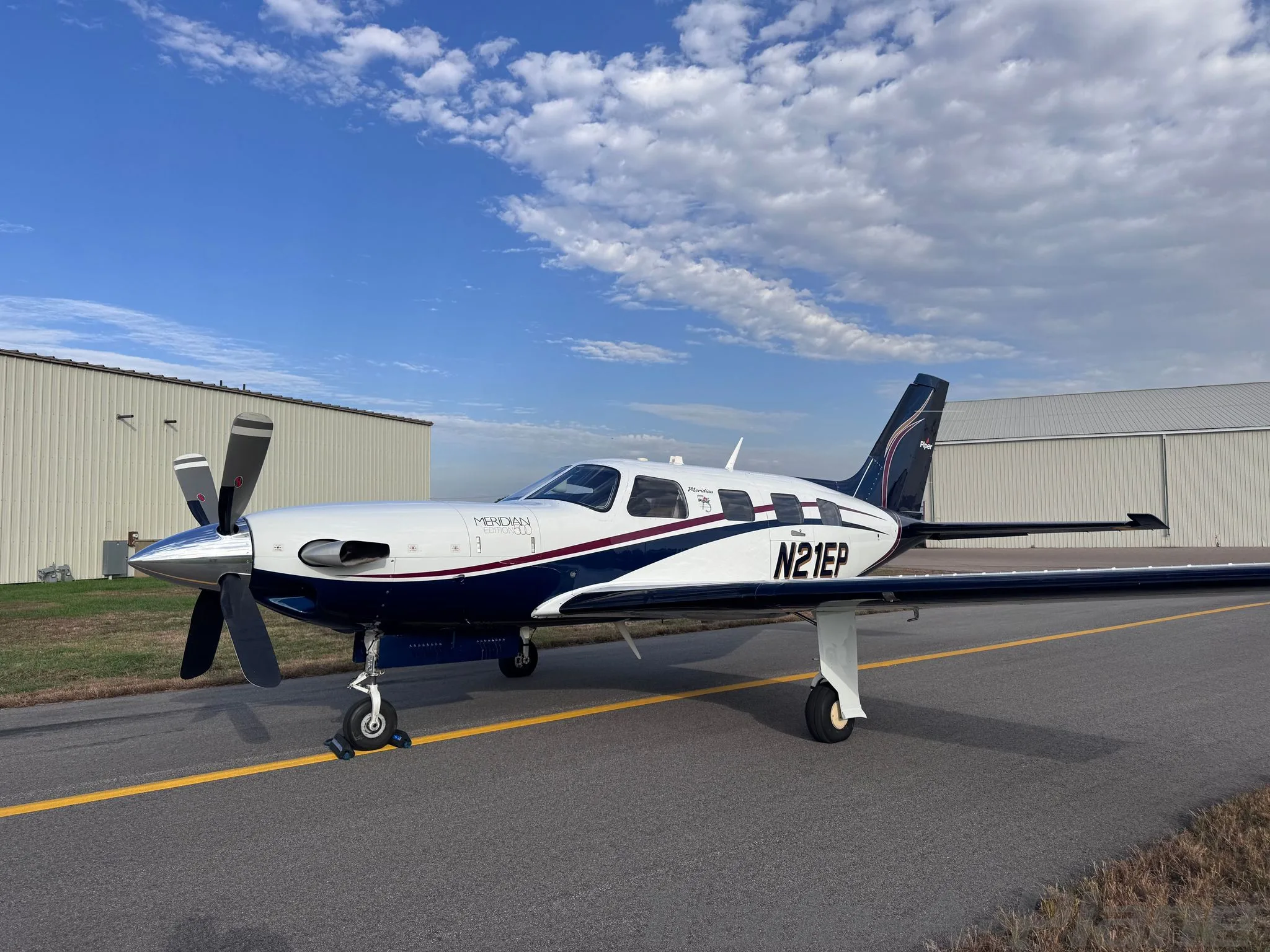 Exterior view of a 2013 PIPER MALIBU MERIDIAN, N21EP.