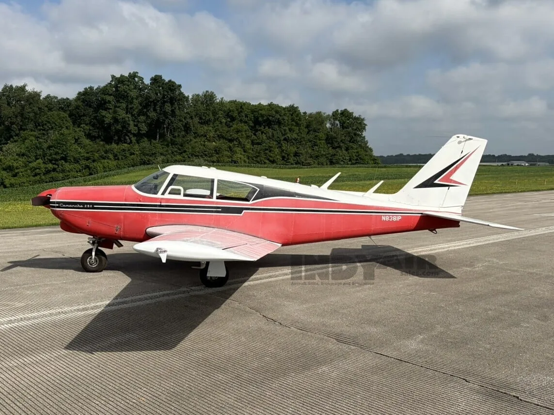 Exterior view of a Piper Comanche 250, N8381P.