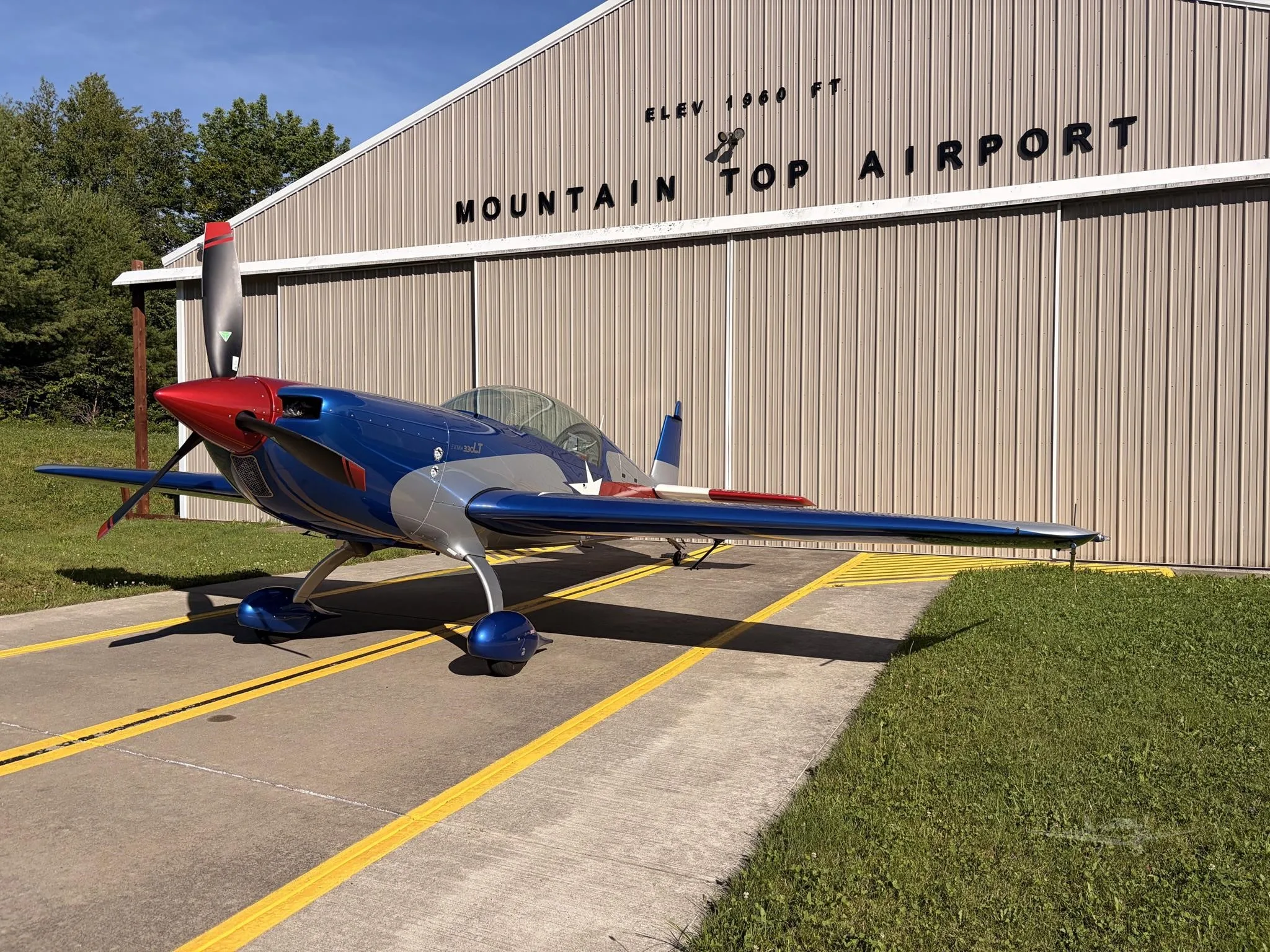 Exterior view of a 2014 EXTRA AIRCRAFT EA 330LT, N328LT.