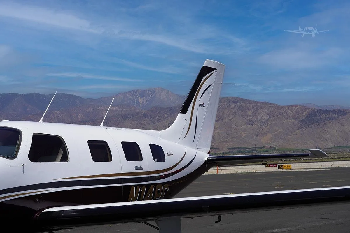 Exterior view of a 1989 PIPER MALIBU MIRAGE, N14PC.